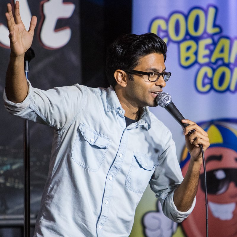 Asif Ali on stage at a Cool Beans Comedy show.