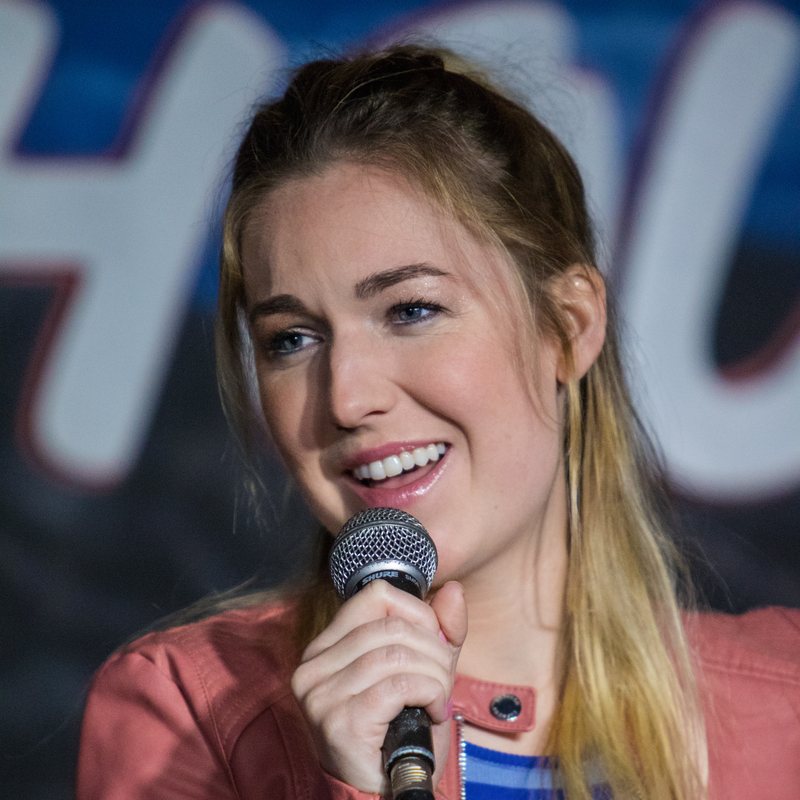 Delanie Fischer on stage at a Cool Beans Comedy show.