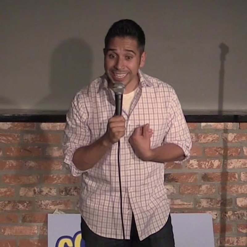 Erik Rivera on stage at a Cool Beans Comedy show.