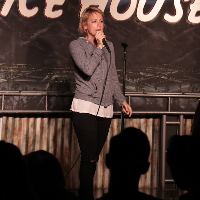 Iliza Shlesinger on stage at a Cool Beans Comedy show.