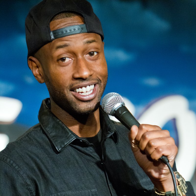 James Davis on stage at a Cool Beans Comedy show.