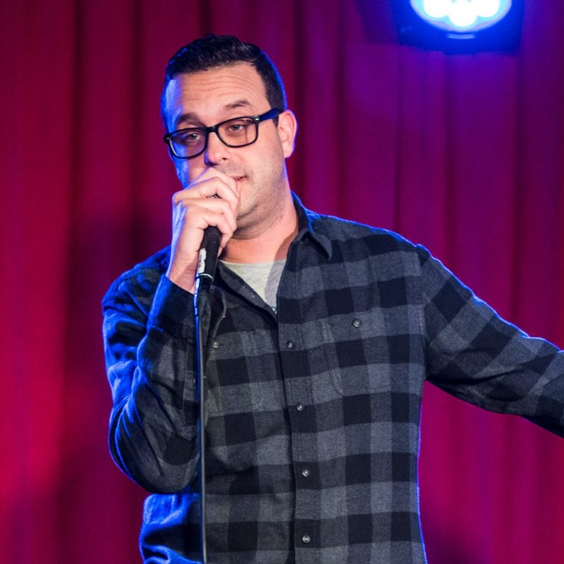 Joe DeRosa on stage at a Cool Beans Comedy show.