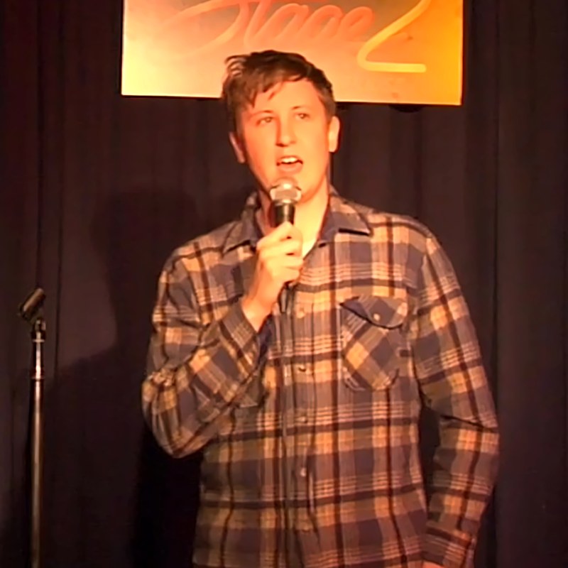 Johnny Pemberton on stage at a Cool Beans Comedy show.