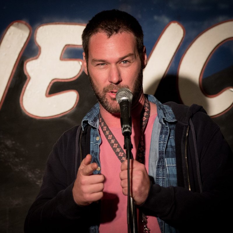 Jon Dore on stage at a Cool Beans Comedy show.
