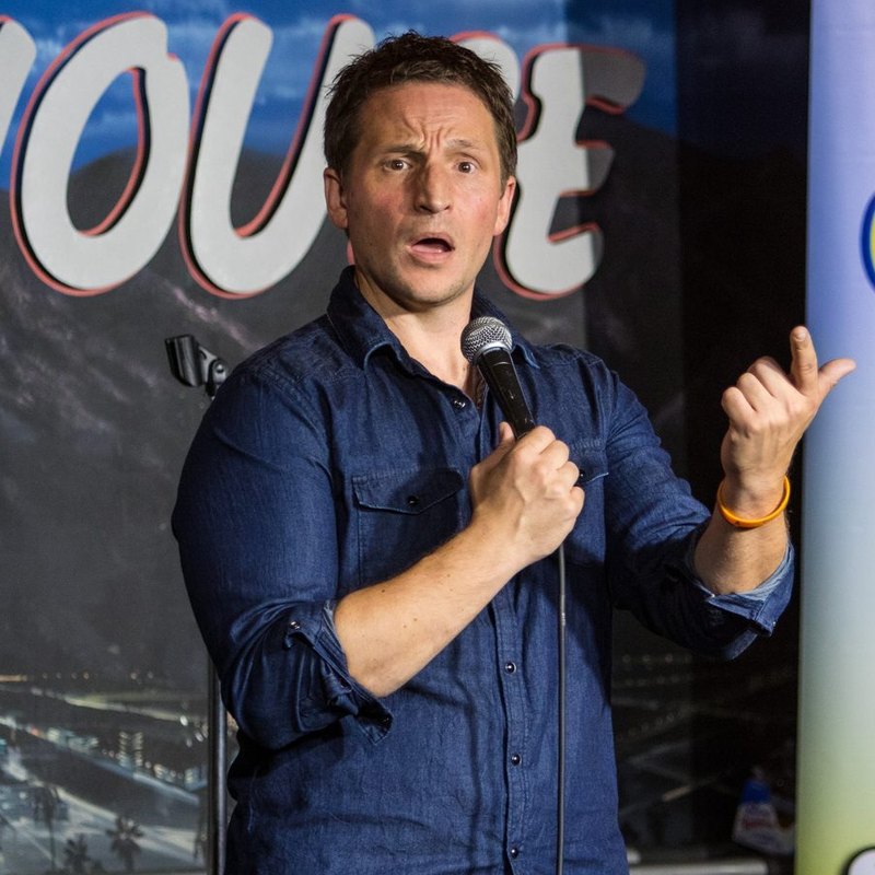 Jonny Loquasto on stage at a Cool Beans Comedy show.