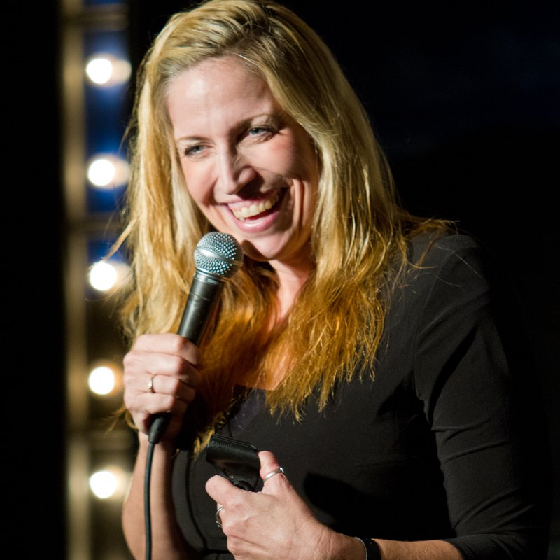 Laurie Kilmartin on stage at a Cool Beans Comedy show.