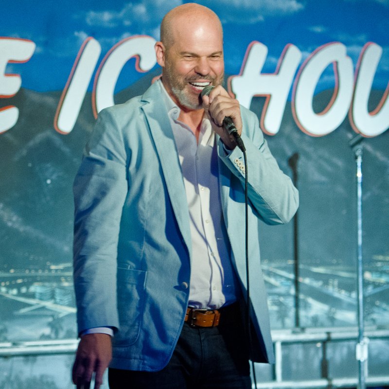 Matthew Moore on stage at a Cool Beans Comedy show.