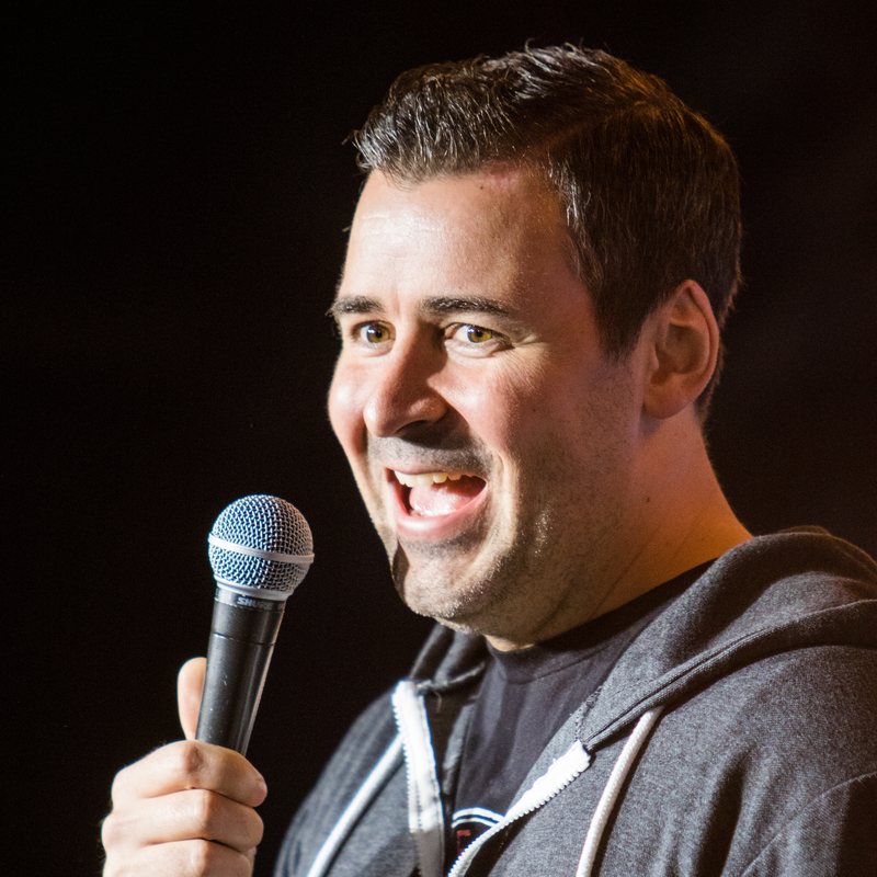 Pete Lee on stage at a Cool Beans Comedy show.