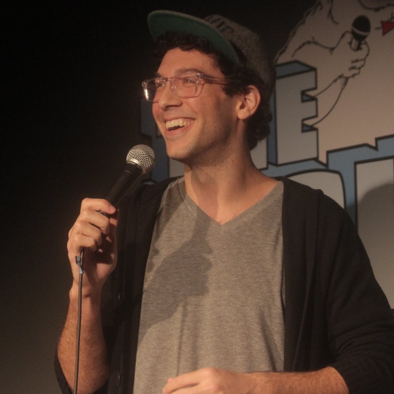 Rick Glassman on stage at a Cool Beans Comedy show.